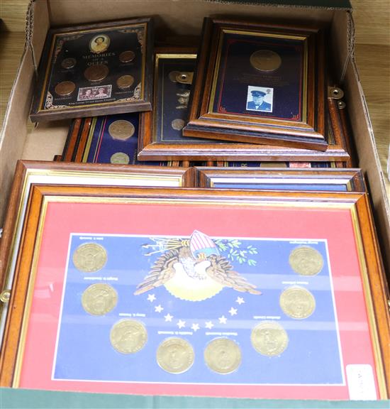 A collection of twenty-one framed coin, banknote, stamp and commemorative medal collections,